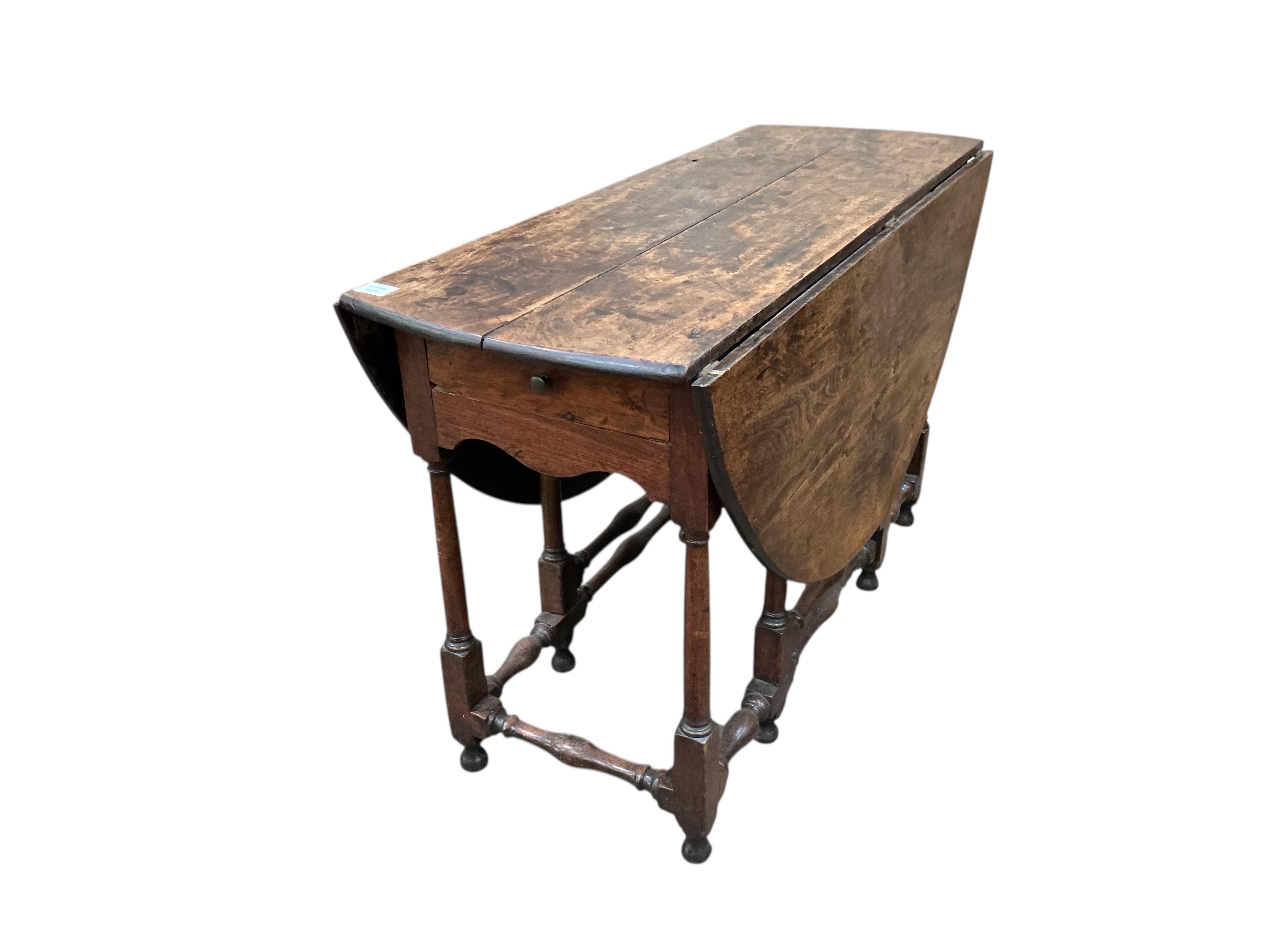 An 17th / 18th century fruitwood gateleg table, width 116cm, depth 46cm, height 74cm